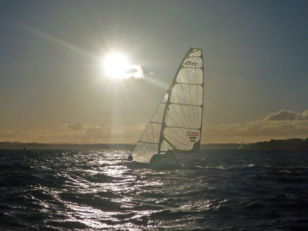 Sunset heading into Russell - - Burling Tuke 49er ride in the 2009 Coastal Classic © Burling Media